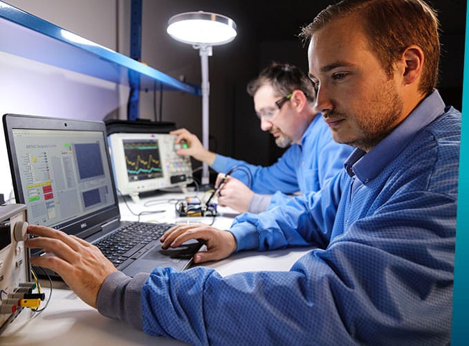 two men using monitoring equipment