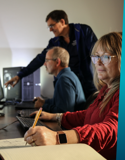 Three people working in an office environment